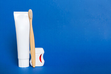 toothpaste and toothbrush top view with copy space on colored background. Flat lay. Dental hygiene....