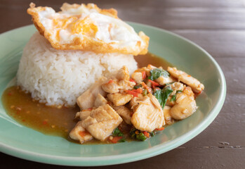 Stir fried Thai basil with chicken and a fried egg