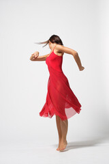 Young modern ballet woman dancer dancing on gray studio background - 511011372