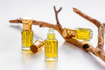 Bottles of agarwood tree oil perfume, close up. Traditional Arabian fragrance