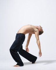 modern ballet male dancer posing over white studio background - 511012184