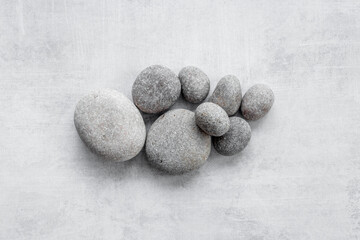 Fototapeta na wymiar Spa massage gray stones. Beauty treatment background