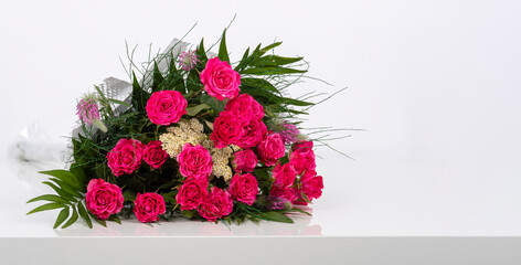 Bouquet of flowers - a composition of pink roses. Background for a postcard and a banner.