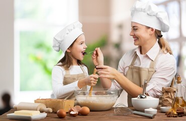 Happy young family eating in the living room