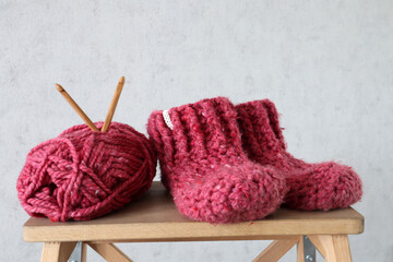 Red crocheted boots. Handiwork.