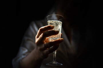 person holding a glass of beer