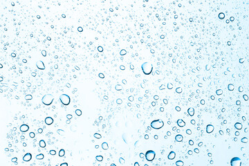 Fototapeta na wymiar Water drops on car glass. Rain drops on the clear window.