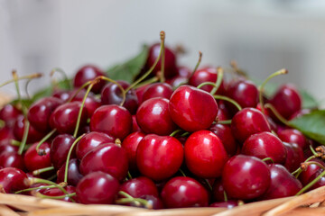 Fresh sweet cherries  in woden basket. Eco production organic fruits - concept. Close up