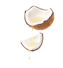 Coconut oil dripping from cracked coconut fruits  isolated on white background. - obrazy, fototapety, plakaty