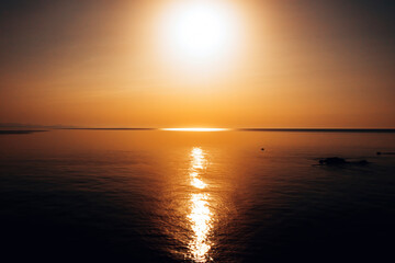 sunset at sea. variety of colors and hues of the rising sun. . High quality photo