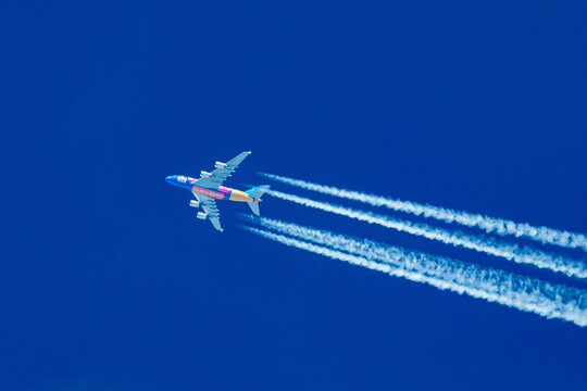 enns, austria, 14 june 2022, airbus a-380-861, a6-eeu, operated by emirates with painting dubai expo flying on a blue sky