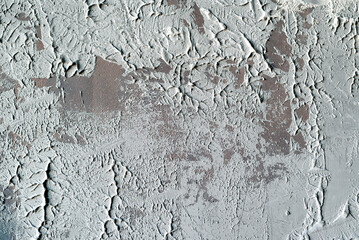The texture of the old gray concrete wall for the background in the loft style with scuffs and scratches. drips of paint brown and gray.