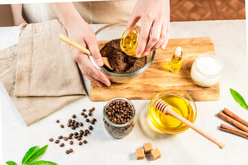 Woman mixing ingredients preparing coffee scrub or mask for skin treatment