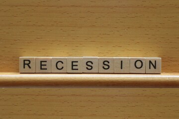 Recession concept, the word recession in wooden blocks on a wooden background with copy space - 511028320