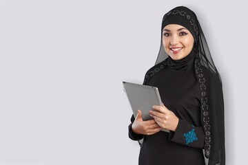 Smiling young woman using a digital tablet, received good news