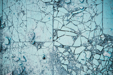 Blue abstract backdrop. Broken ceramic tiles on the ground texture background. Crashed, shattered...