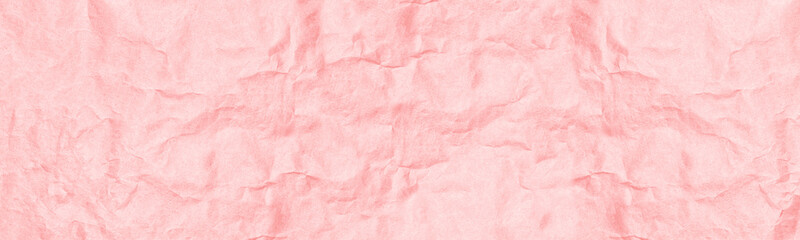 Fototapeta premium Coral color crumpled kraft old paper wide panoramic texture. Pastel pink orange wrinkled craft paper sheet surface. Abstract light vintage background