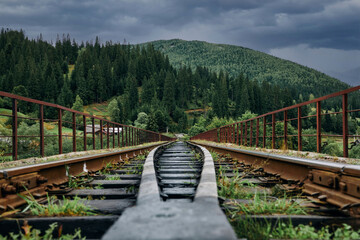 Mountains on the background of the railroad tracks bottom view. High quality photo