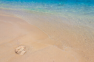 Soft wave of ocean on sandy beach