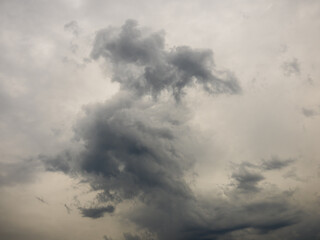 Fototapeta na wymiar Unusual storm clouds in gray sky