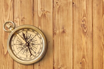 Compass. Traditional navigation device indicating the cardinal points (north, south, east, and west).