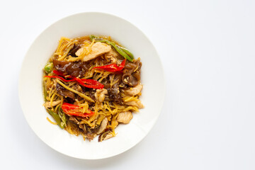 Stir fried chicken with ginger on white.