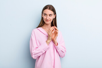 young adult pretty woman scheming and conspiring, thinking devious tricks and cheats, cunning and...