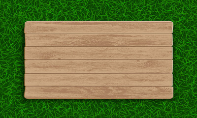 Wooden plate on green grass background.