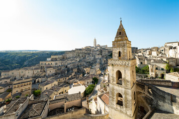 Fototapeta premium Stunning view of the Matera’s skyline during a beautiful sunny day. Matera is a city on a rocky outcrop in the region of Basilicata, in southern Italy.
