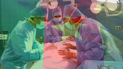 Animation of flag of cameroon over diverse doctors during surgery - Powered by Adobe