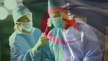 Animation of flag of algeria over caucasian doctors during surgery - Powered by Adobe