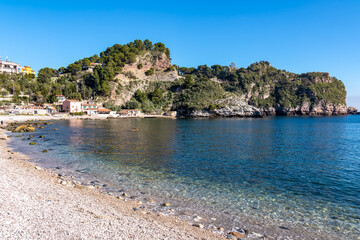 Panoramic view from beach Spiaggia di Isola Bella on paradise resort peninsula in Taormina, Sicily,...