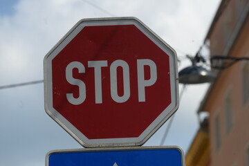 red stop sign in traffic