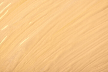 Abstract fluid art background light beige colors. Liquid marble. Acrylic painting on canvas with cream gradient.