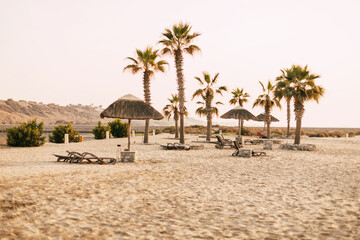 Obraz na płótnie Canvas Ras Al Khaimah, UAE - April 2022 - Relaxing on the beach at The Cove Rotana Resort