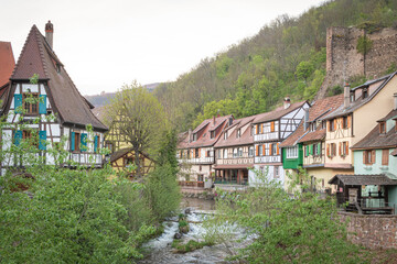 Fototapeta na wymiar Traditional old alsatian houses in Kaysersberg in Alsace in the department of Haut-Rhin of the Grand Est region of France