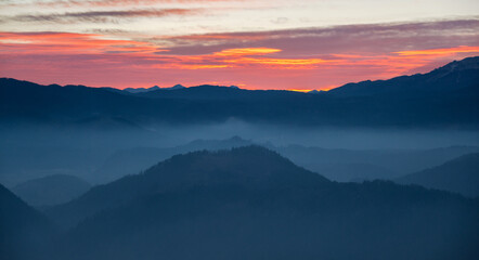 Fototapeta na wymiar Dark and vivid sunset in the mountains