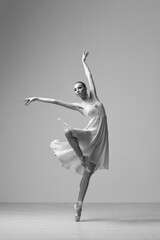 Young Beautiful Female Ballerina Posing on Studio Background - 511045327