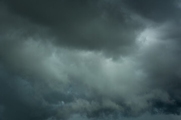 Naklejka na ściany i meble Black clouds before thunder storm closeup