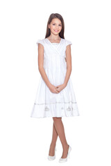 Beautiful girl in white dress posing on white background