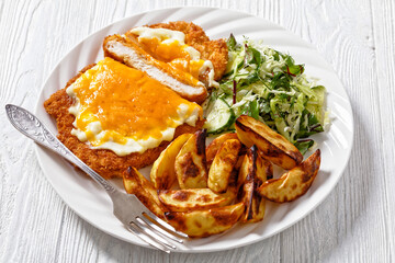 chicken parmo with coleslaw and roast potatoes