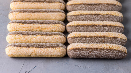 Ladyfinger Biscuit Cookie on Gray Concrete Background Italian Cookie Savoiardi Long