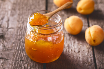 Homemade Jam From Apricots in a Glass Jar on a Wooden Background Tasty Dessert Horizontal