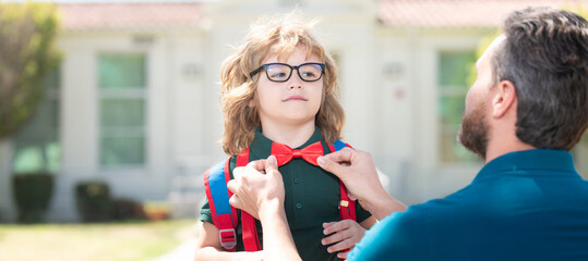 Banner of child pupil back to school, parent gathering little child boy at first grade fix bow tie,...
