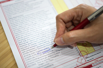 Marking or underline at "Risk assessment" requirement on the work permit document paper. Safety in industrial and business working concept scene photo. Selective focus.