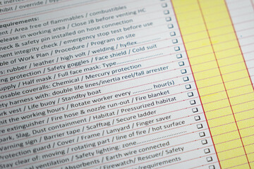 Safety checklist items with tick box on the work permit document paper. Industrial working concept...
