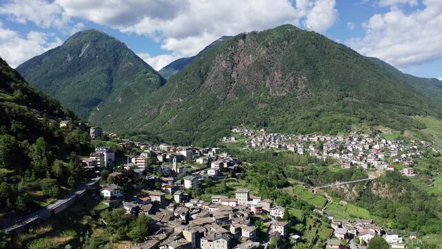 Aerial 4K, Valtellina, Italy, view of the villages of Ponchiera and Mossini with Bridge of Cassandre