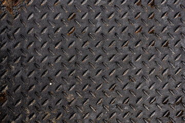 Rusty steel diamond plate texture. gray colored diamond plate background. grey steel metal plate with painted surface and industrial diamond pattern texture. 