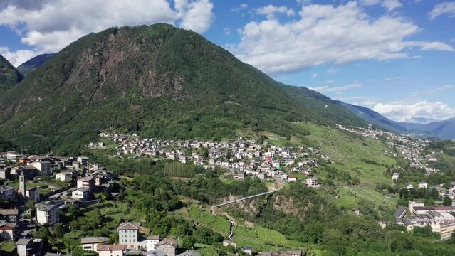 Aerial 4K, Valtellina, Italy, view of the villages of Ponchiera and Mossini with Bridge of Cassandre