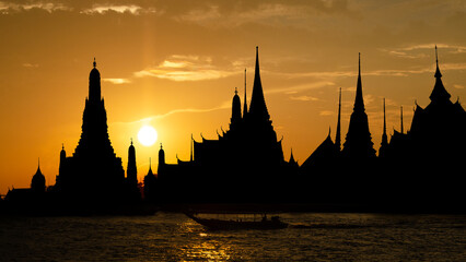 Silhouette with wat arun , wat pho and wat phra kaew on sunset background.